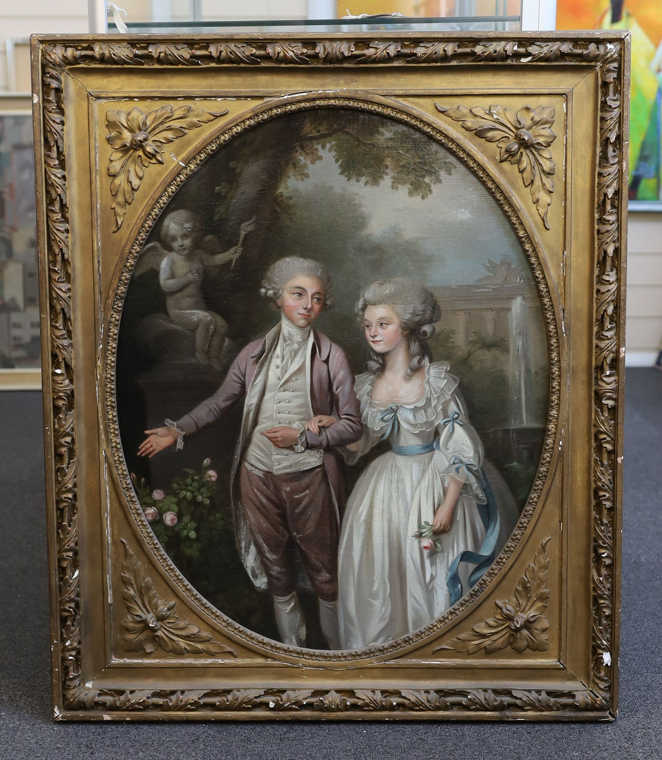 Late 18th century English School, Three quarter length portrait of a husband and wife admiring roses in an Italianate garden, oil on canvas, oval, 71 x 57cm